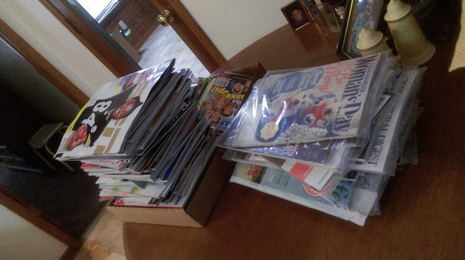 Photo: Two tall stacks of magazines sent by scam magazine agents
