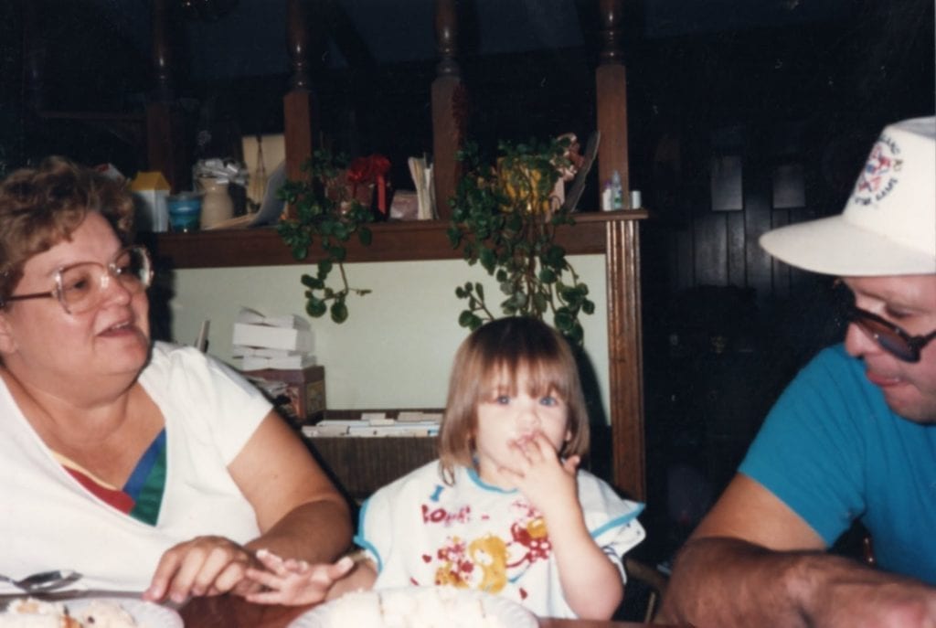 Photo: Rachel's grandmother, left, Rachel as a little girl eating cake with her fingers, center, and her uncle Kenny, right